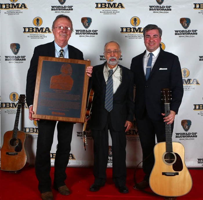 Roland White (center) at the International Bluegrass Music Association awards show in Raleigh in September, when he accepted the IBMA Hall of Fame award on behalf of his late brother Clarence, the legendary guitar player. (Clarence and Roland, late brother Eric, Billy Ray Latham and LeRoy McNees were the Country Boys in the "Mayberry on Record" episode of TAGS. All but Roland, who had joined the Air Force, also were in the epilogue of "Quiet Sam." All but Eric went on to form the Kentucky Colonels. Clarence later joined The Byrds. Holding the Hall of Fame plaque is Herb Perdesen, a longtime member of The Dillards. At right is top bluegrass performer Patrick Sauber. Photo by Dave Brainard.