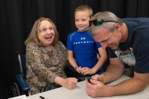 Betty Lynn enjoys visiting with a couple of happy fans during Mayberry Days.  Photo by Hobart Jones.