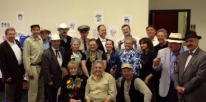 Maggie Peterson and Rodney Dillard (seated in front) are surrounded by tribute artists, festival organizers and fans at Mayberry in the Midwest in Danville, Ind.