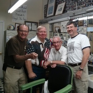 CHEERY GROUP AND A CHAIR--Russell Hiatt enjoys a visit with incognito friends Tim "Goober " Pettigrew, Kenneth "Otis" Junkin and Allan "Floyd Jr." when the trio popped in for visit after breakfast at the Snappy Lunch on Aug. 22.  Photo tweeted by Allan.