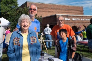 Jeff Koontz (The one seemingly as tall as the Andy Griffith Playhouse) and family at the Mayberry Days Silent Auction.  Photo by Hobart Jones.