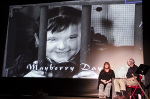 CAPTIVE AUDIENCE--Joy Ellison smiles over her own shoulder during Mayberry lecture wit Neal Brower in Mount Airy in September.  Photo by Alan Thornton.