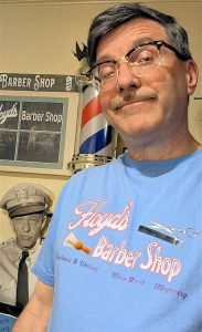 Allan modeling Floyd's Barber Shop Main Street T-shirt