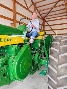 Macon, Mo. - At a special Blood Brothers chapter gathering, Dixie enjoyed reconnecting with her childhood on a vintage tractor.